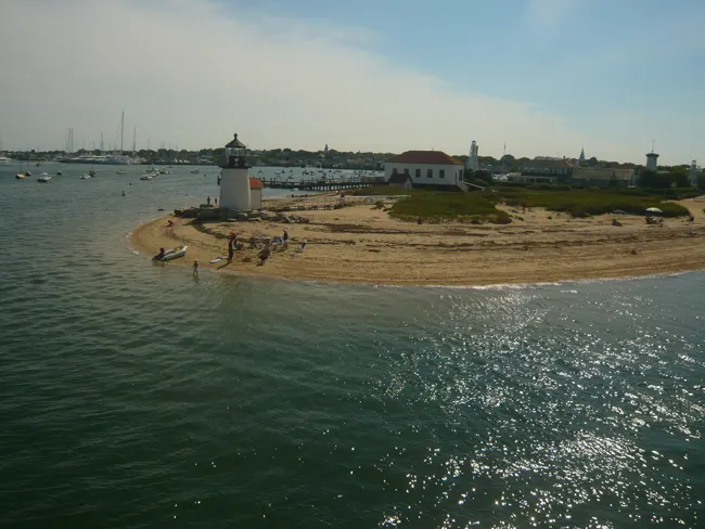 Sailboats and the shore at the entrance to Nantucket Harbor, photographed in 2008